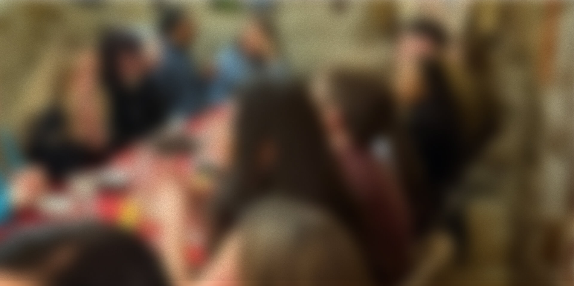 Background image of employees at a Meraki event